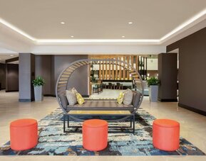 Lobby seating at Embassy Suites By Hilton Orlando Airport.