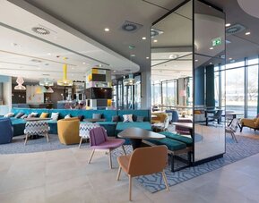 Lobby and lounge at Hampton By Hilton Krakow Airport.