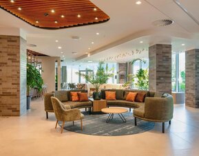 Lobby and lounge at Hilton Garden Inn Brussels Airport.