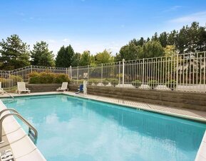 Outdoor pool at Country Inn & Suites By Radisson, Norcross, GA.