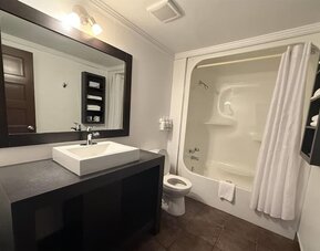 Bathroom at Ramada Laval By Wyndham.