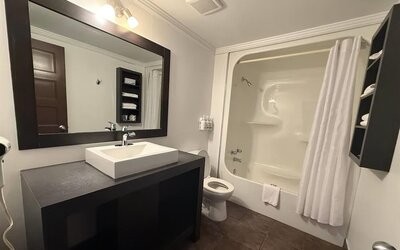 Bathroom at Ramada Laval By Wyndham.