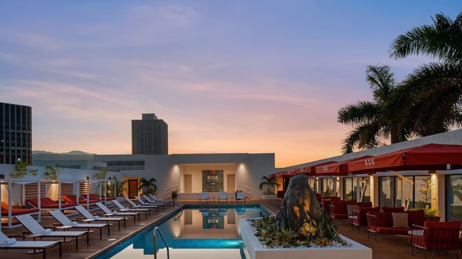 Pool loungers and cabanas at ROK Hotel Kingston, Tapestry Collection By Hilton.