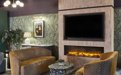 Lobby and fireplace at Leonardo Hotel Dublin Parnell Street.