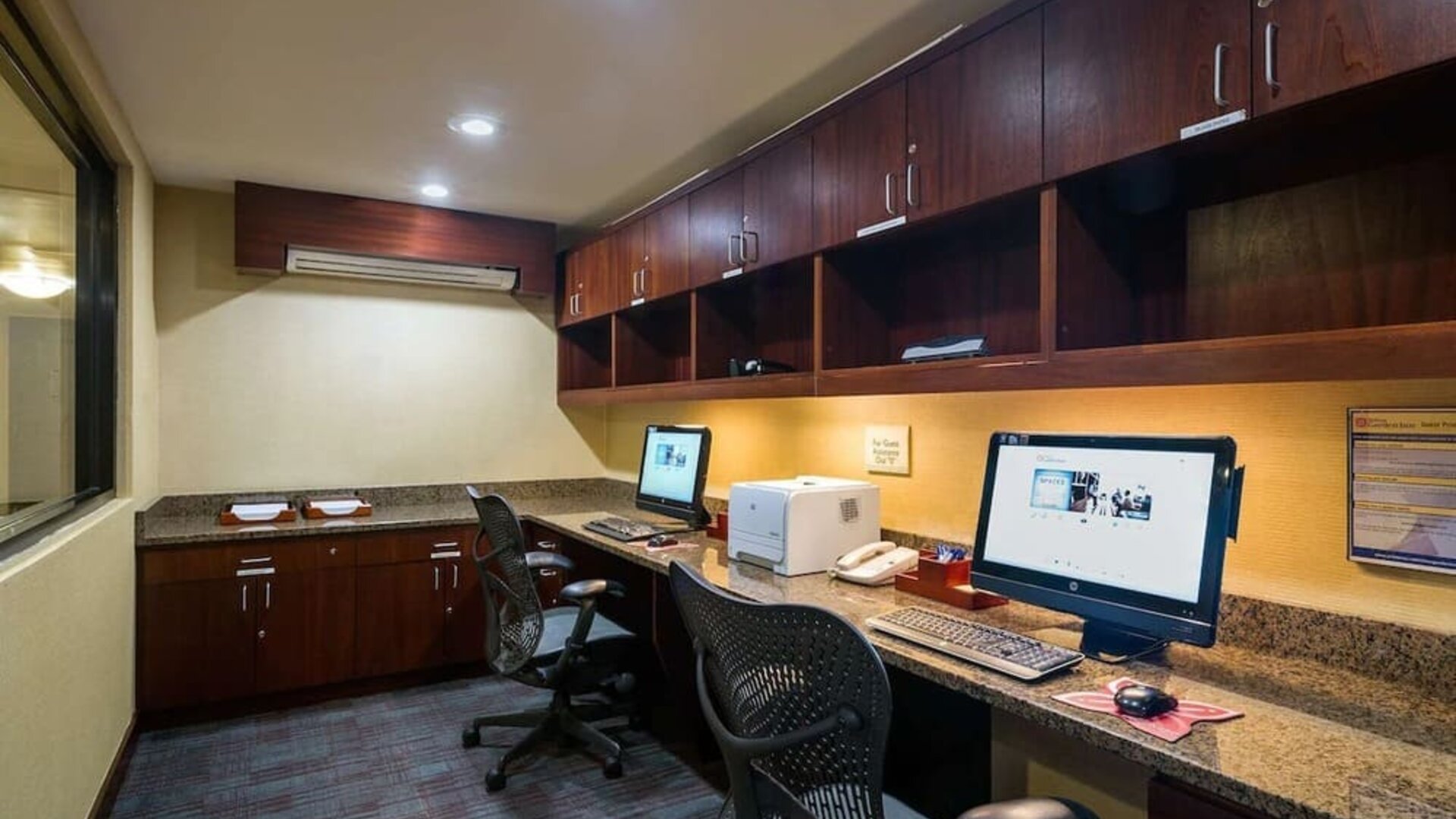 Fully equipped business center at Hilton Garden Inn Tribeca available for guest use.