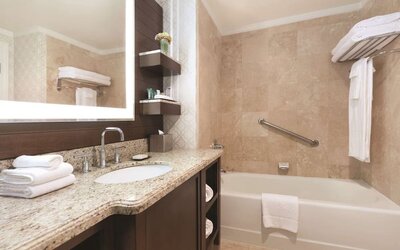 Modern bathroom at Hilton Los Angeles/San Gabriel with modern facilities and plush towels.