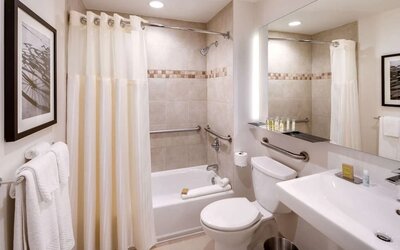 Fully equipped bathroom with plus towels at DoubleTree By Hilton Jersey City.