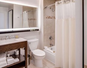 Fully equipped bathroom with plus towels at DoubleTree By Hilton Jersey City.