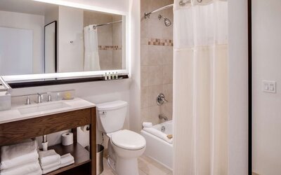 Fully equipped bathroom with plus towels at DoubleTree By Hilton Jersey City.