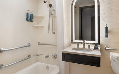 Modern, fully equipped bathroom at Hilton Fashion District.