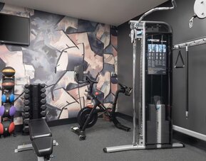 The hotel’s fitness center, equipped with a range of exercise machines.