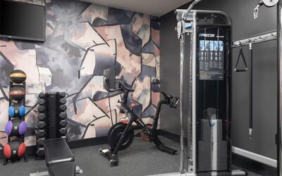 The hotel’s fitness center, equipped with a range of exercise machines.