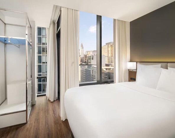 Comfortable day room with natural light at Best Western Premier Empire State Hotel.