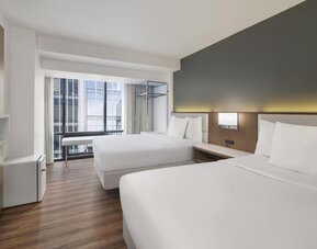 Comfortable day room with natural light at Best Western Premier Empire State Hotel.