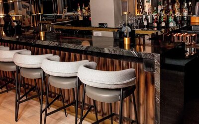 Bar at The Draper Tapestry Collection By Hilton perfect for socializing.