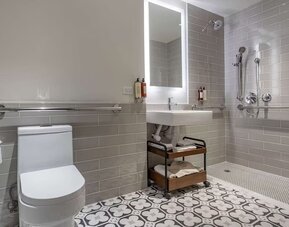 Modern bathroom with plush towels at The Draper Tapestry Collection By Hilton.