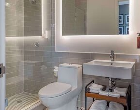Modern bathroom with plush towels at The Draper Tapestry Collection By Hilton.