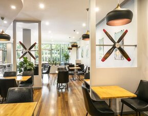 Dining area with natural light perfect for coworking at Crowne Plaza Sydney Airport.