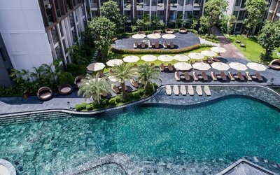 Large outdoor pool at Divalux Resort & Spa Bangkok Suvarnabhumi Airport.