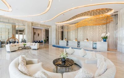 Lobby with comfortable seating at Divalux Resort & Spa Bangkok Suvarnabhumi Airport.