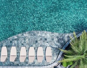 Large outdoor pool at Divalux Resort & Spa Bangkok Suvarnabhumi Airport.