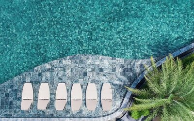 Large outdoor pool at Divalux Resort & Spa Bangkok Suvarnabhumi Airport.