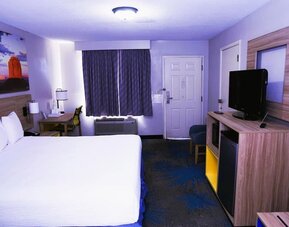 Day room with work desk at Days Inn By Wyndham East Albuquerque.