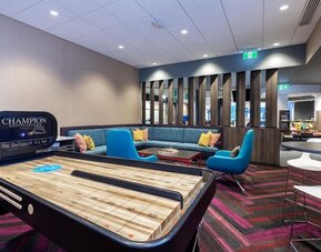 Game room with pool table at Tru By Hilton Montreal Centre-Ville.