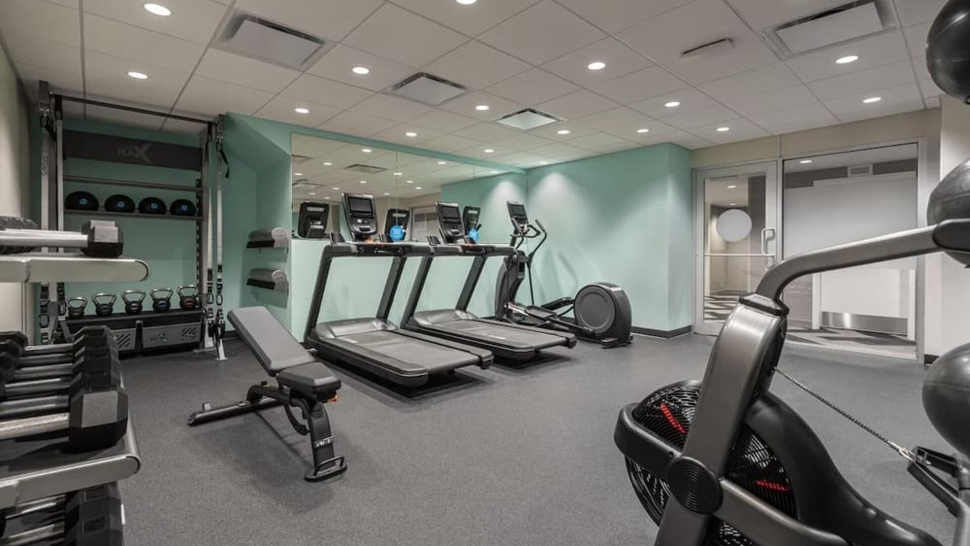 Fitness center with treadmills at Tru By Hilton Montreal Centre-Ville.