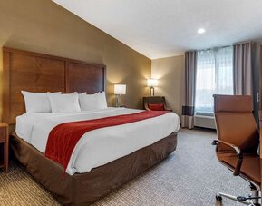 Day room with a desk, chair and plenty of natural light at Comfort Inn Glenmont - Albany South.