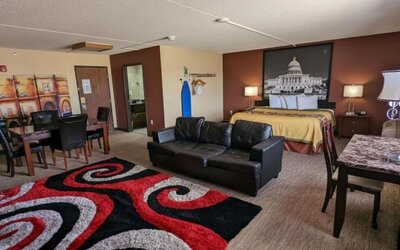 Day room with a couch and workspace at Coratel Inn And Suites By Jasper Wichita North