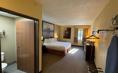 Day room with a desk and chair at Coratel Inn And Suites By Jasper Wichita North