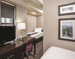 Day use room with work desk at La Quinta Inn & Suites By Wyndham New York City Central Park.