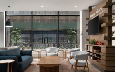 Inviting lobby featuring comfortable seating at EVEN Hotel Brooklyn By IHG.