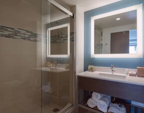 Modern bathroom with plush towels at EVEN Hotel Brooklyn By IHG.