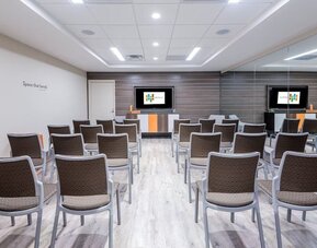 Spacious meeting room perfect for presentations and training at EVEN Hotel Brooklyn By IHG