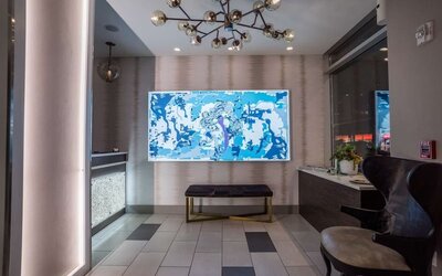 Welcoming reception with seating at The Bernic Hotel New York City, Tapestry Collection By Hilton.