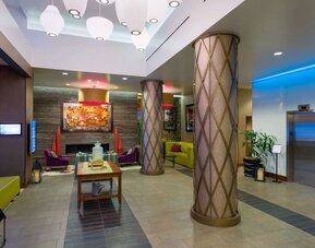 Lobby with comfortable seating at Hilton Garden Inn Midtown East..