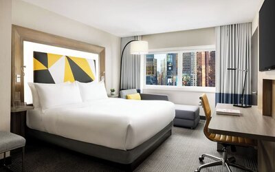 Day use room with workspace and natural light at M Social Hotel Times Square.