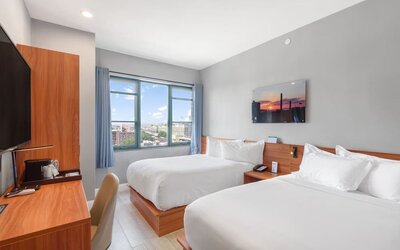 Day use room with work desk and natural light at Liberty View Brooklyn Hotel.