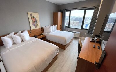 Day use room with work desk and natural light at Liberty View Brooklyn Hotel.