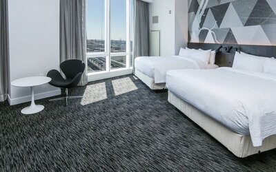 Day use room with workspace and natural light at Courtyard By Marriott Long Island City/New York Manhattan View.