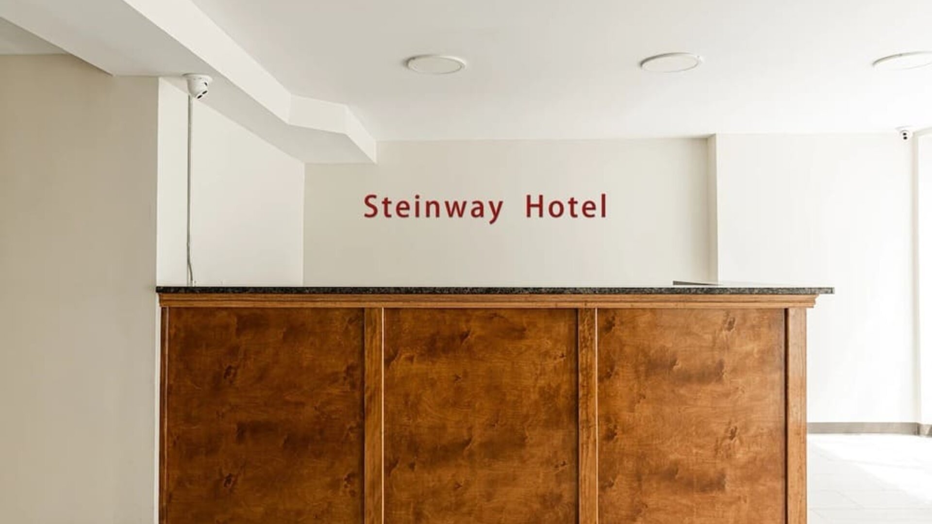 Reception at Astoria Inn LaGuardia Hotel.