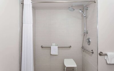 Bathroom at Travelodge by Wyndham Fundamental.