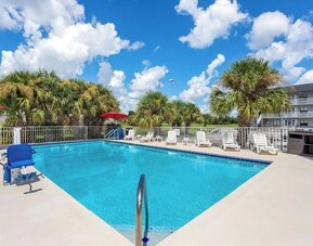 Outdoor pool at Howard Johnson by Wyndham Highway.