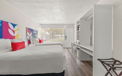 Day room with workspace and natural light at Baymont by Wyndham Maingate.