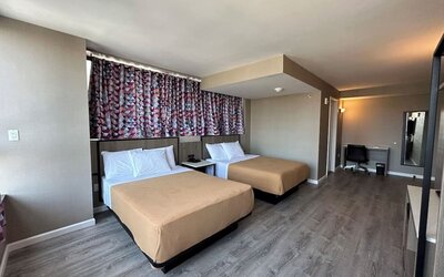 Day use room with work desk at Regal Inn & Suites New York.