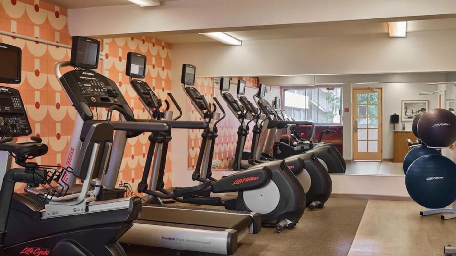 Fitness center with cardio machines including treadmills and ellipticals at The Ambassador Hotel Of Waikiki.
