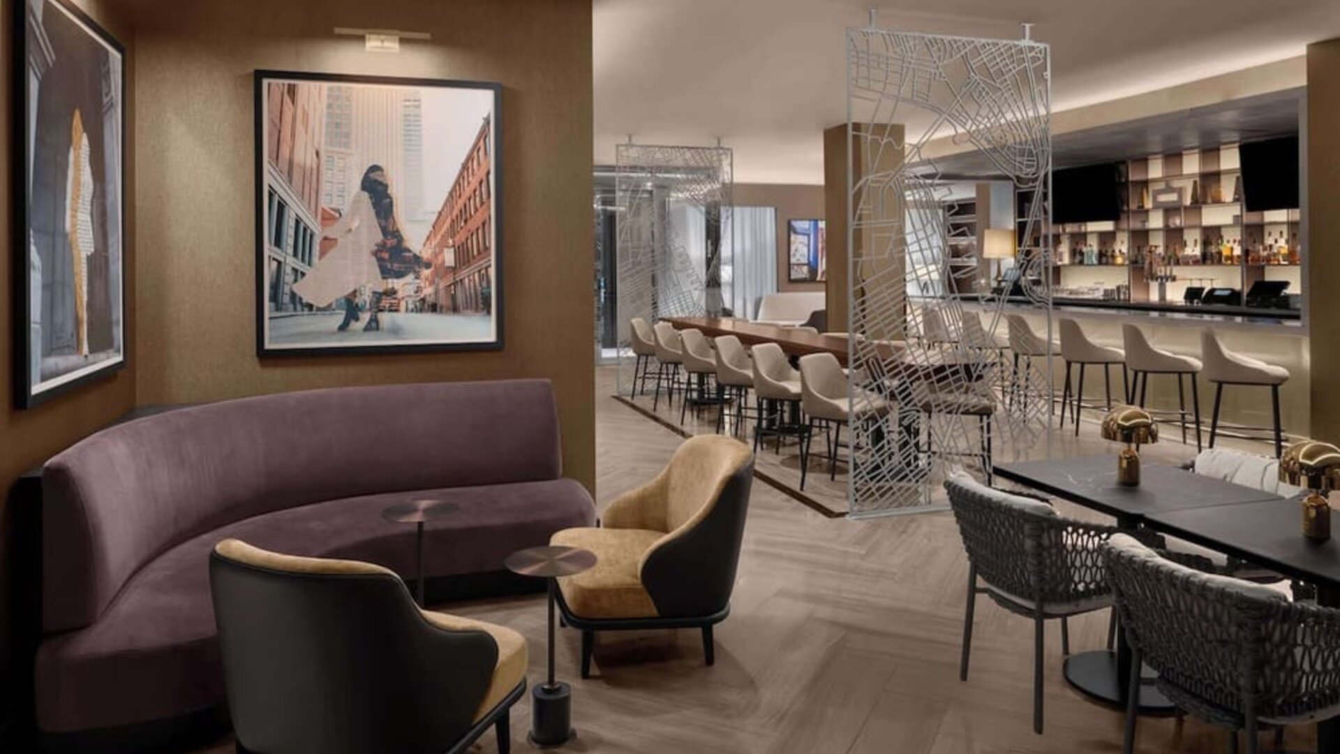 Lounge and bar area with seating, tables, and dining space at Hilton Brooklyn New York.
