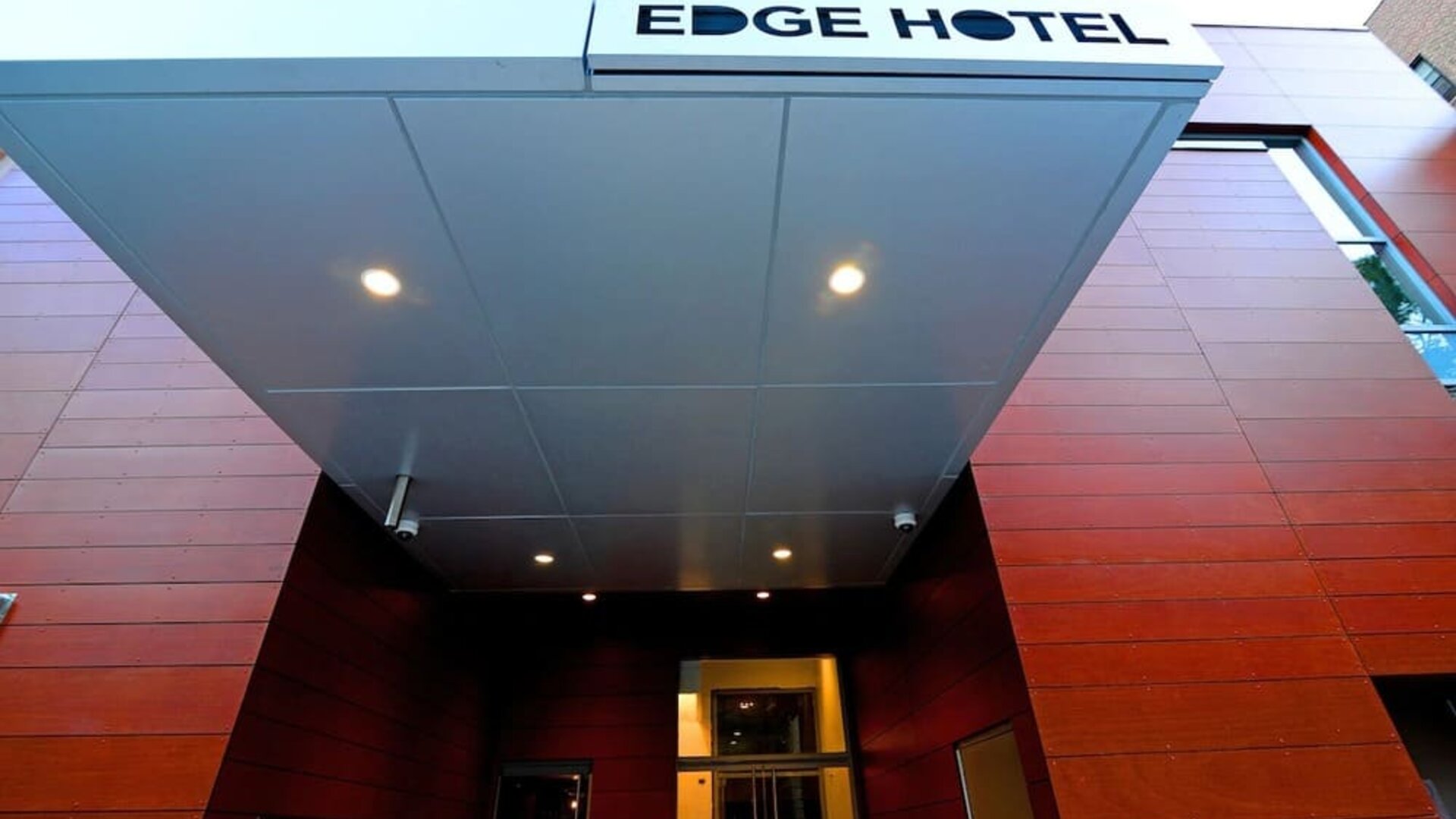 Entrance view with Edge Hotel signage and modern exterior design at Edge Hotel NYC.